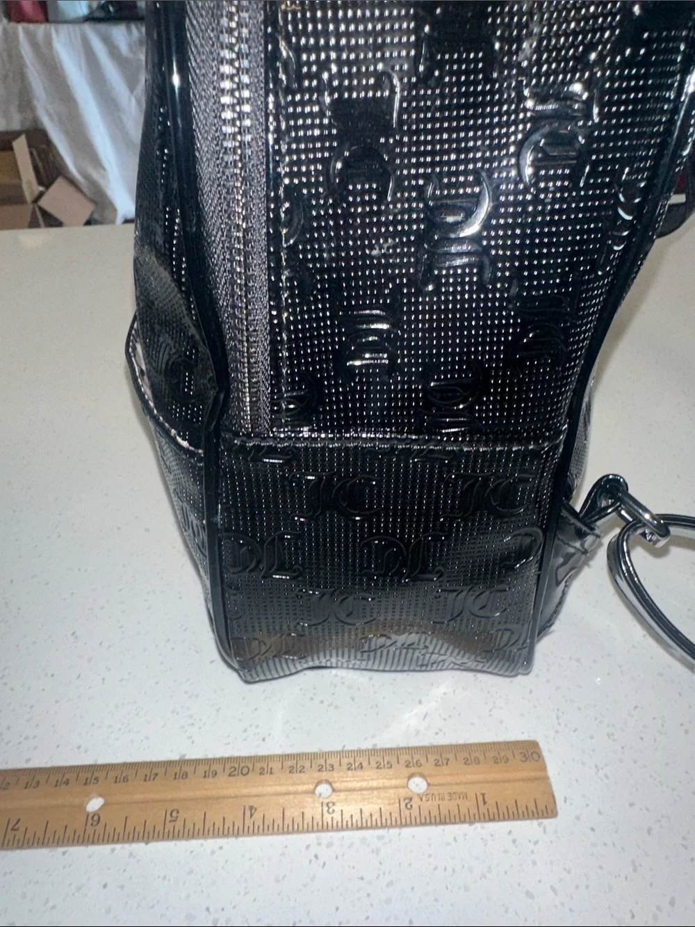 Juicy Couture Black Patent Mini Backpack, new without tags. Excellent condition.